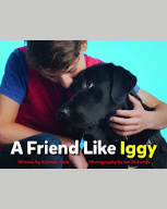 Cover of "A Friend Like Iggy" with a boy hugging a black lab