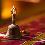 A brass bell sitting on a table