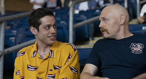 Peter Davidson as Scott with Bill Burr as Ray at a baseball game.