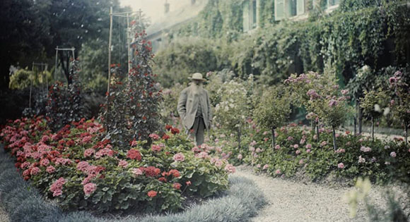 Claude Monet in front of his home in Giverny