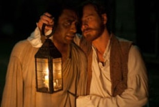 Chiwetel Ejiofor as Solomon and Michael Fassbender as Edwin Epps