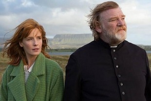 Kelly Reilly as Fiona and Brendan Gleeson as Father James