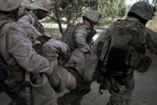 Marines of Echo Company 2nd Battalion, 8th Marine Regiment carry an injured soldier