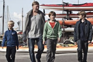 Mikael Persbrandt as  Anton with his two sons and their friend