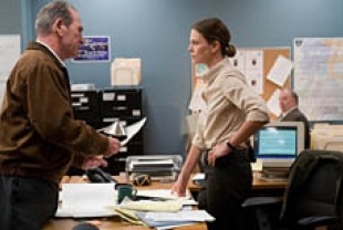 Tommy Lee Jones as Hank and Charlize Theron as Emily Sanders