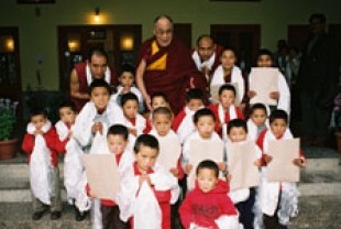The Dalai Lama with children at monastery