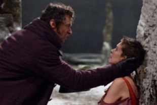 Hugh Jackman as Valjean and Anne Hathaway as Fantine