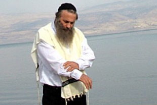 Assi Dayan as Rabbi Edelman
