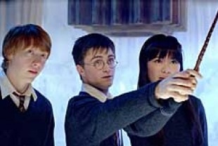 Rupert Grint as Ron, Daniel Radcliffe as Harry, and Katie Leung as Cho Chang