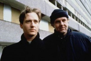 Linus Roache as Father Greg and Tom Wilkinson as Father Matthew