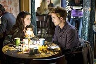 Kristen Stewart as Bella and Robert Pattinson as Edward
