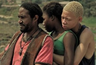 Ralph Prosper as The Butcher, Rachel Mwanza as Komona and Serge Kanyinda as Magician