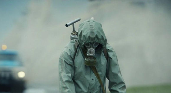 Man in protective suit, gas mask in a toxic fog from Chernobyl