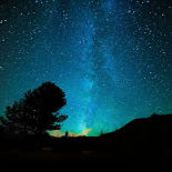 A dark blue night sky with zillions of tiny stars.