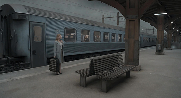 Patient woman at train station