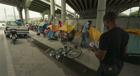 Dr. Armen Henderson taking medical care to homeless people in Miami. 