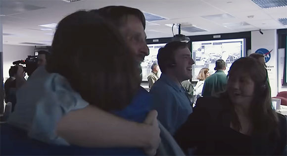 Engineers and scientists celebrate Oppy's success.