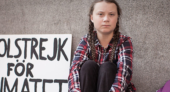 Greta Thunberg striking in front of the Swedish parliament