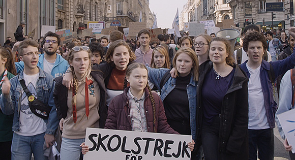 Greta Thunberg with other young people marching for climate action.