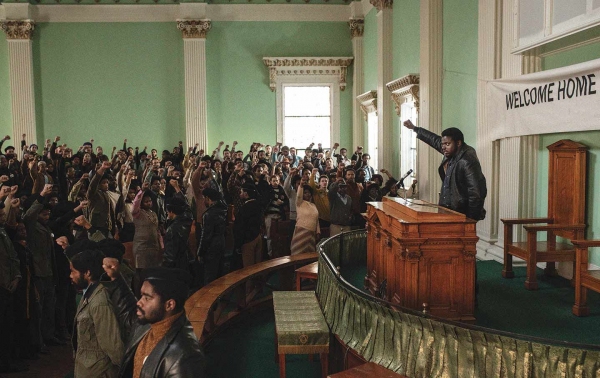 Daniel Kaluuya as Fred Hampton before a crowd of Black Panthers