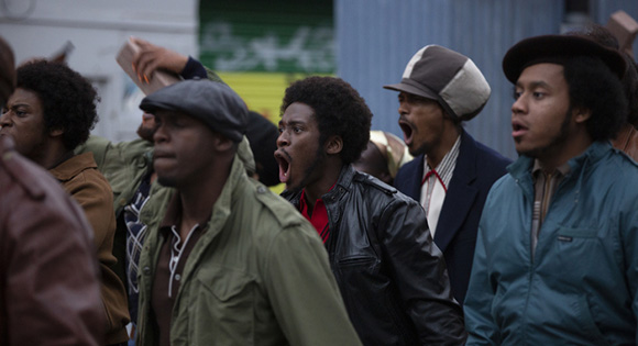 Sheyi Cole as Alex Wheatle at the Brixton Uprising.