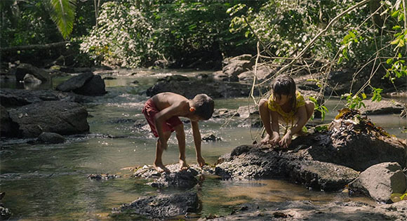 Uru-eu-wau-wau children playing in the river in the territory.