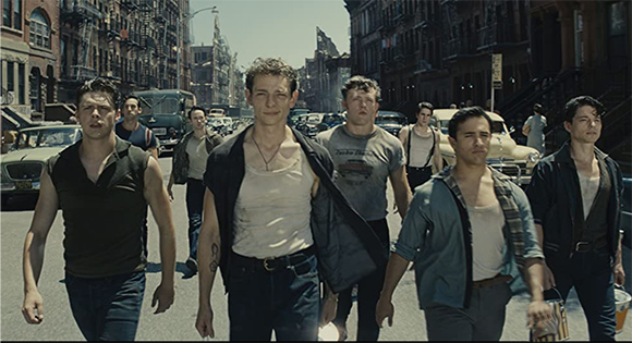Riff (Mike Faist) leads the Jets through the city streets