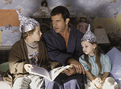 Rory Culkin as Morgan, Mel Gibson as Graham, and Abigail Breslin as Bo