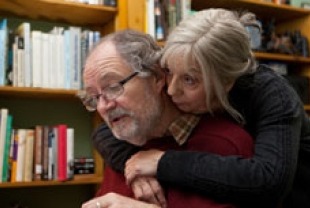 Ruth Sheen as Gerri hugging Jim Broadbent as Tom