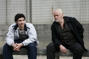 Tahar Rahim as Malik and Niels Arestrup as Luciani