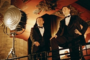 John C. Reilly as Noah Dietrich and Leonardo DiCaprio as Howard Hughes