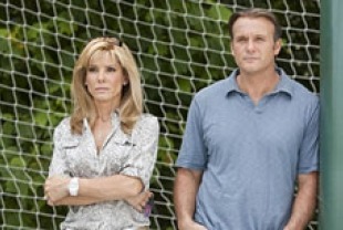 Sandra Bullock as Leigh Anne Tuohy and Tim McGraw as Sean Tuohy