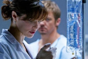 Rachel Weiss as Marta and Jeremy Renner as Aaron Cross