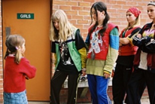 Baily Madison as May Belle confronts Lauren Clinton as the bathroom bully