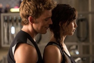 Sam Clafin as Finnick and Jennifer Lawrence as Katniss