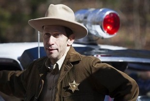 Tim Blake Nelson as Sheriff Fate