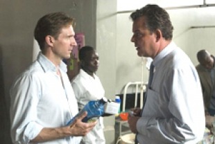 Ralph Fiennes as Justin and Danny Huston as Sandy