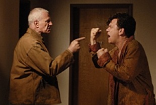 Raymond J. Barry as Father Cox and John C. Reilly as Dewey