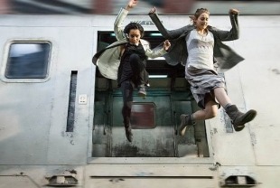 Zoe Kravitz as Christina and Shailene Woodley as Tris