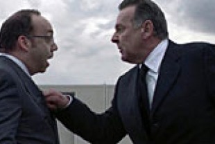 Paul Giamatti as Dick Garsik and Tom Wilkinson as Howard Tully
