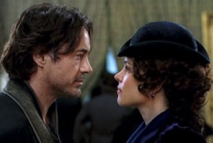 Robert Downey Jr. as Holmes and Rachel Adams as Irene