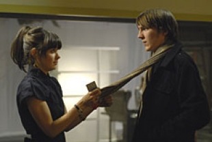 Paul Dano as Brian and Zooey Deschanel as Harriet