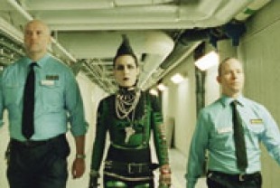 Noomi Rapace as Lisbeth Salander, with girls