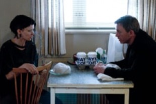 Rooney Mara as Lisbeth and Daniel Craig as Mikael