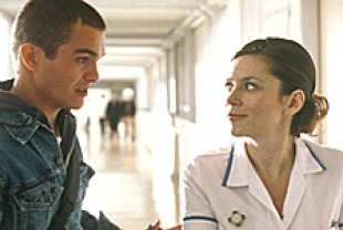 Santiago and Anna Friel as Roz