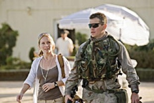 Amy Ryan as  Lawrie Dayne and Matt Damon as Roy Miller