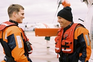 Ashton Kutcher as Fischer and Kevin Costner as Randall
