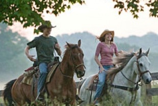 Lucas Till as Travis and Miley Cyrus as Miley