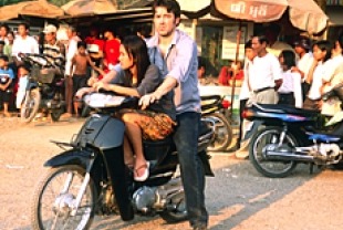 Ron Livingston as Patrick and Thuy Nguyen as Holly