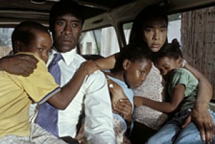 Don Cheadle as Paul with his family